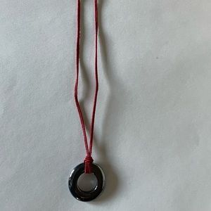 Gun powder color donut pendant with red string necklace